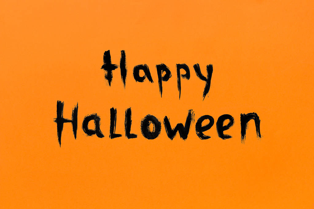 Turuncu arka planda metin yazıt Happy Halloween siyah renk - Fotoğraf, Görsel