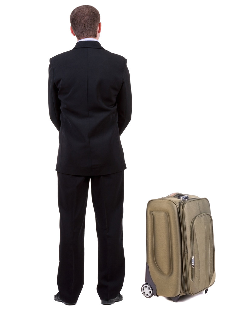 旅行のスーツケースを持つ望ましく男の背面図 - 写真・画像