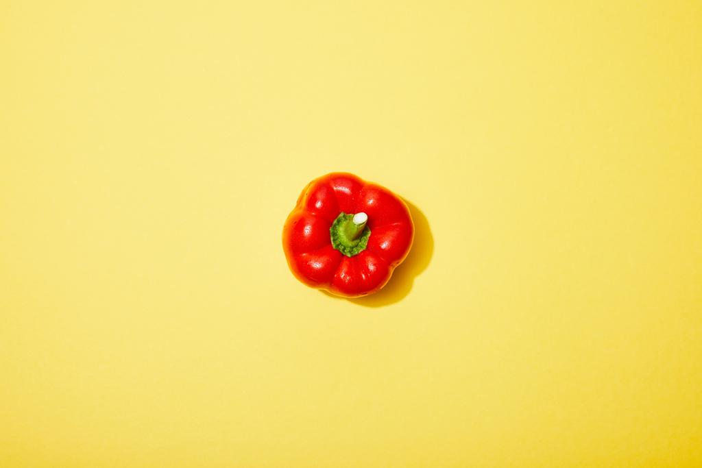 top view of red paprika on yellow background - Photo, Image