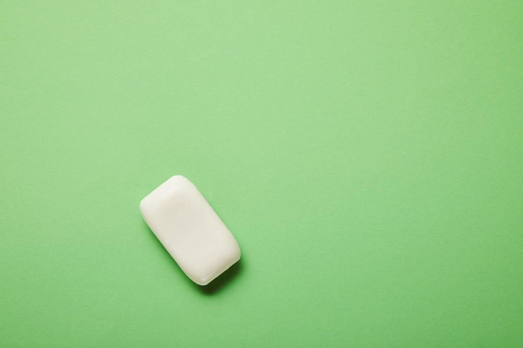 top view of white soap on green background with copy space  - Photo, Image
