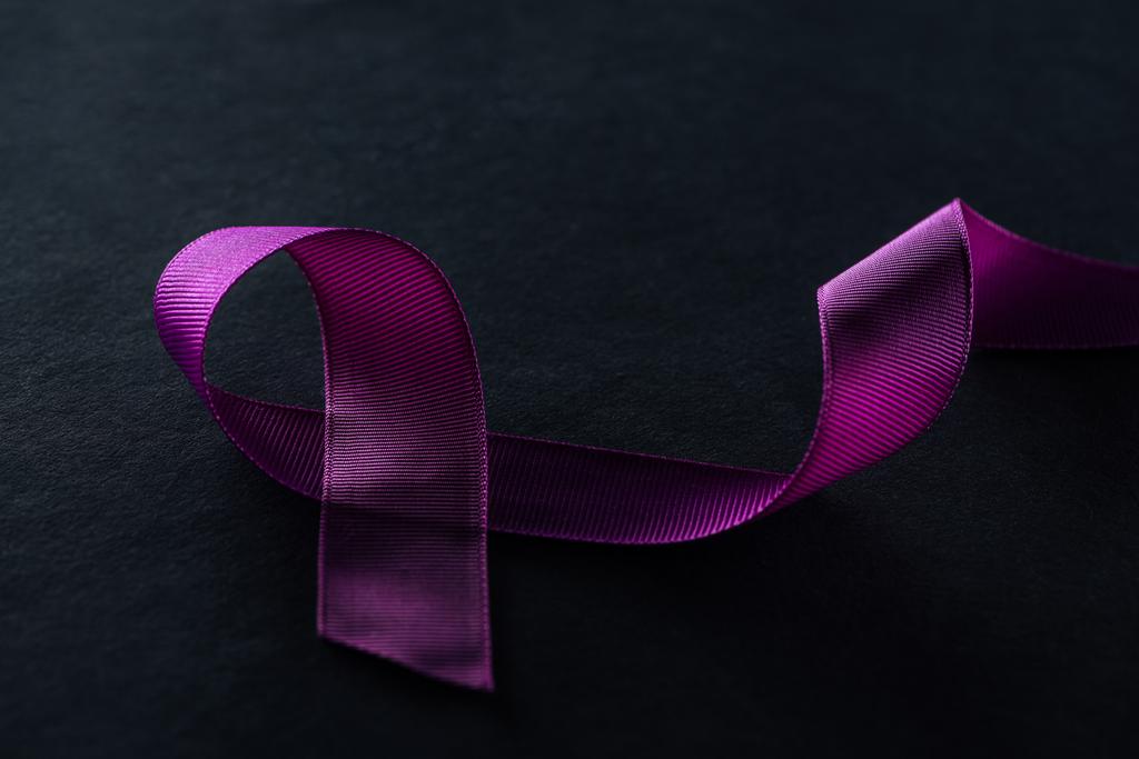 close up view of purple ribbon on black background - Photo, Image
