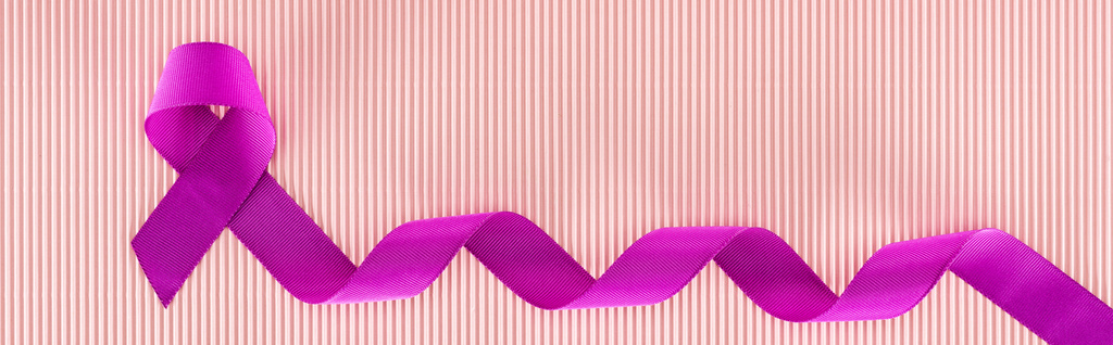 panoramic shot of purple ribbon on pink texture background - Photo, Image