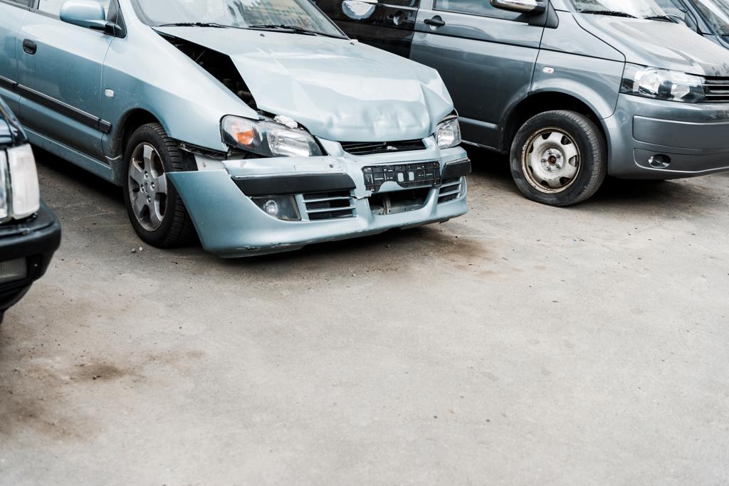 crashed bonnet car after car accident near modern automobiles - Photo, Image