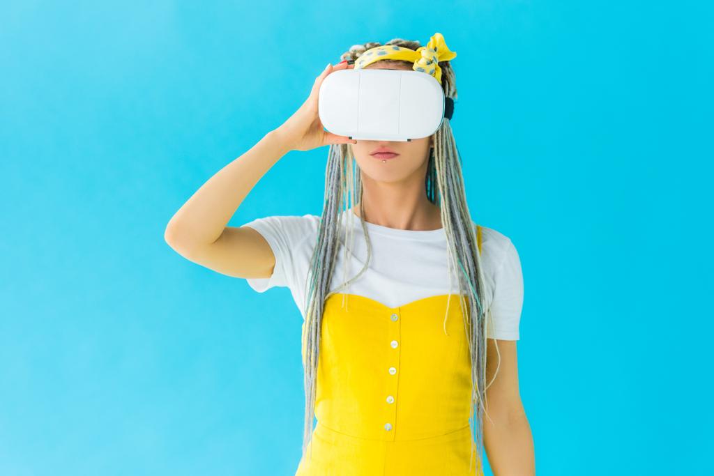 girl with dreadlocks in virtual reality headset isolated on turquoise - Photo, Image