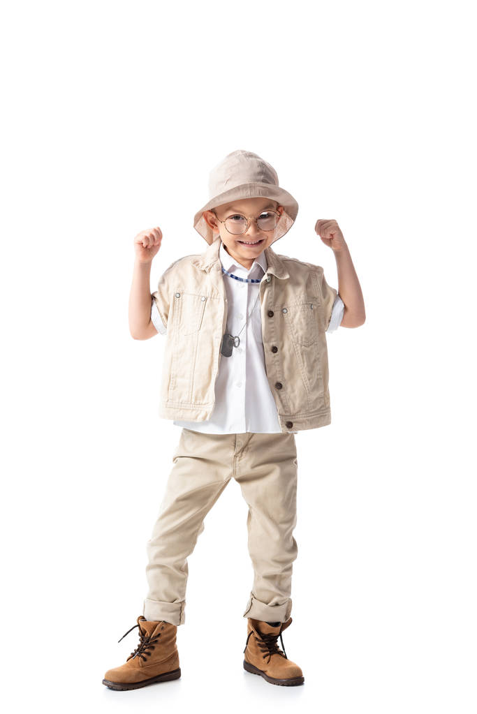 full length view of smiling explorer boy looking at camera and showing yes gesture isolated on white - Photo, Image