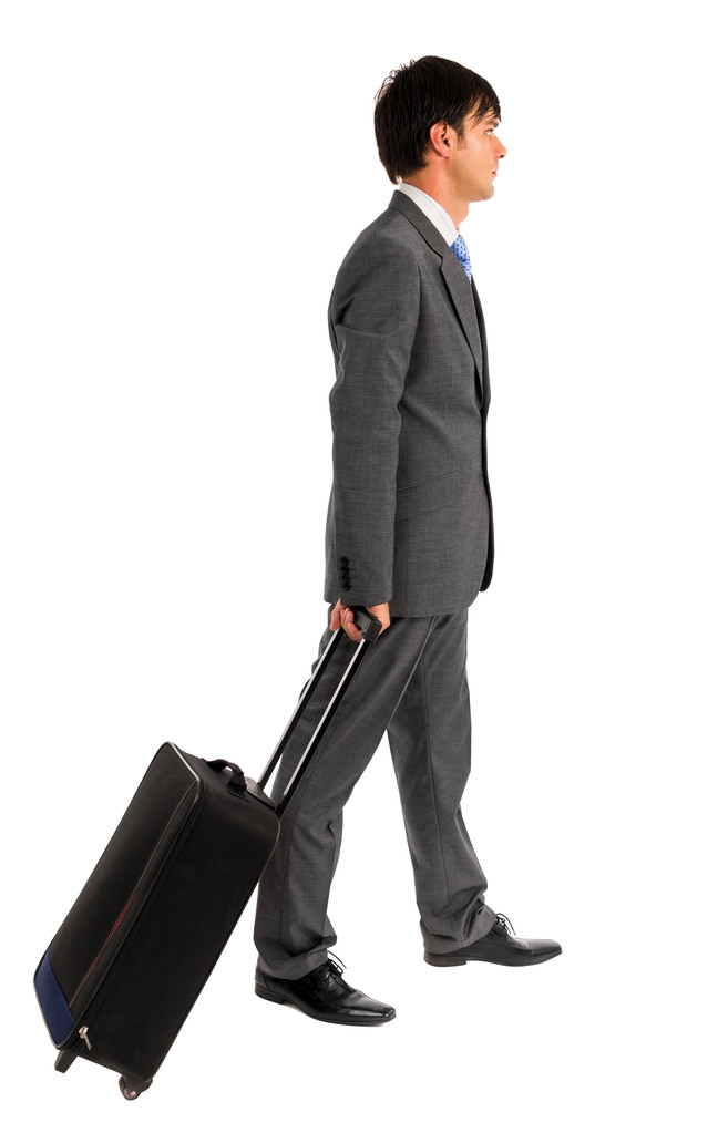 Jovem homem de negócios caminhando com seu saco de carrinho
 - Foto, Imagem