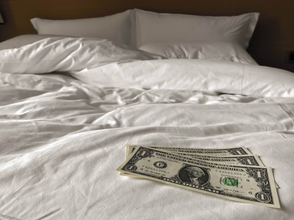 bed and money to symbolize the cost of sex. Paid love the prosti - Photo, Image