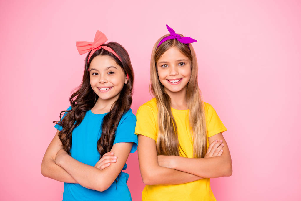 Close-up portrait of two nice attractive winsome charming cute lovely cheerful cheery content pre-teen girls folded arms isolated on pink pastel background - Photo, Image