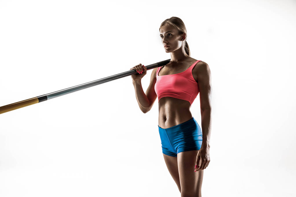 Female pole vaulter training on white studio background - Photo, Image