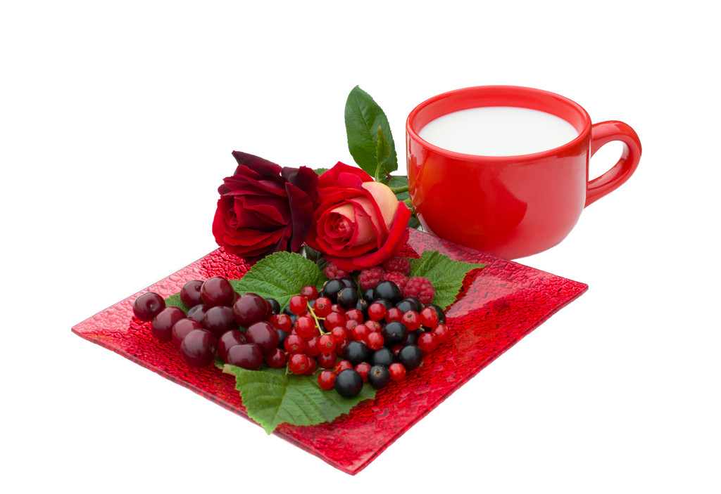 raspberries, currant, cherry, roses and cup of milk - Photo, Image