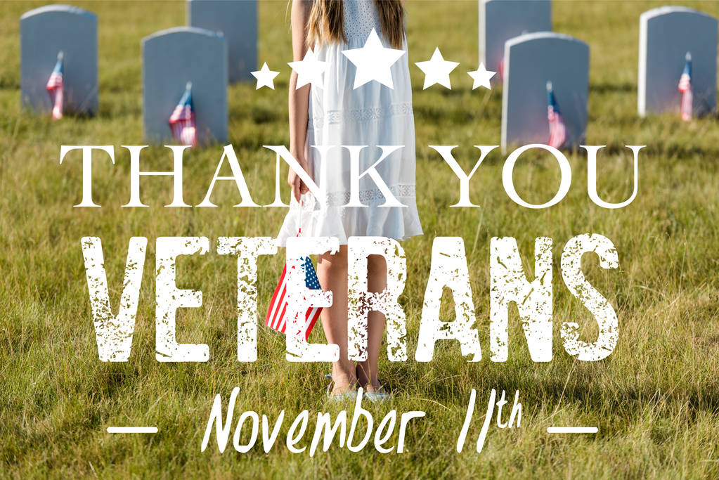 cropped view of kid in white dress standing on graveyard with american flag with thank you veterans illustration - Photo, Image