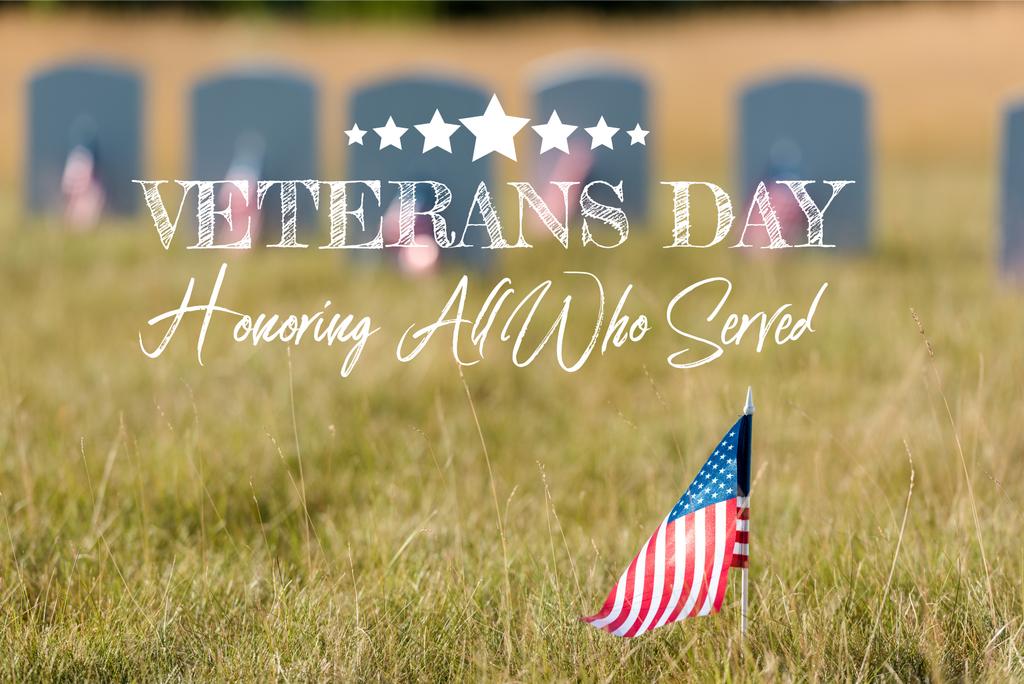 selective focus of american flag with stars and stripes near gravestones with veterans day, honoring all who served illustration - Photo, Image