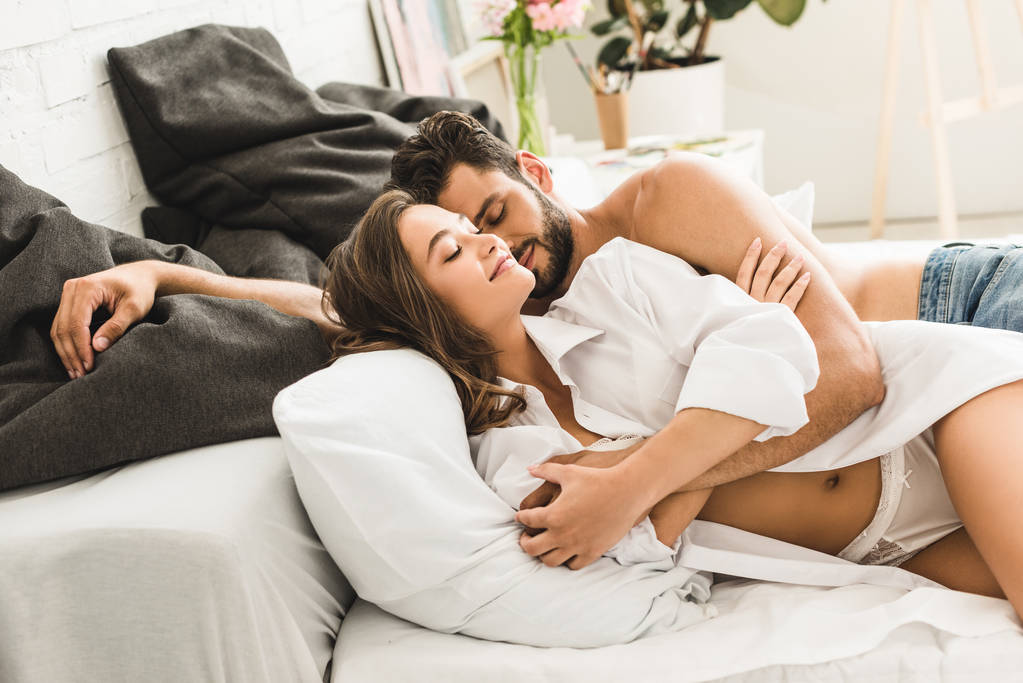 Sexy Young Couple Sleeping And Hugging In Free Stock Photo and Image