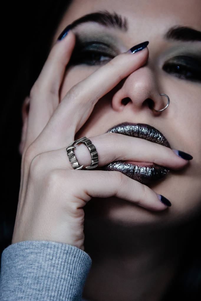 young woman with silver ring on hand - Photo, Image