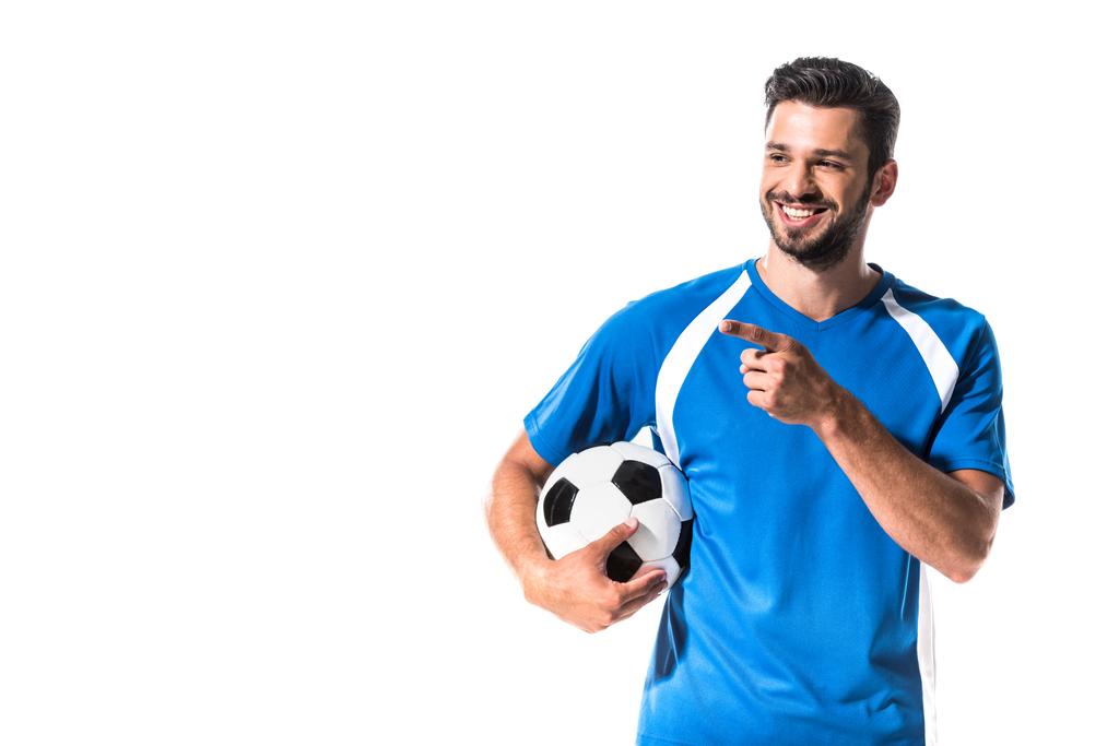 šťastný fotbalista s koulí ukazující prstem izolovaný on White - Fotografie, Obrázek