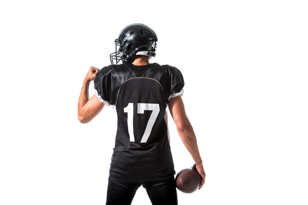 Rückseite des American Football-Spielers mit Ball isoliert auf weiß - Foto, Bild