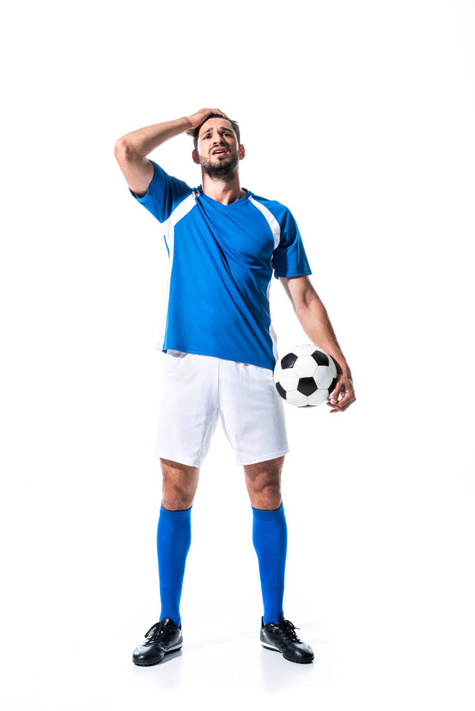 ボールと頭の上に手を持つ失望したサッカー選手は 白に孤立 ロイヤリティフリー写真 画像素材