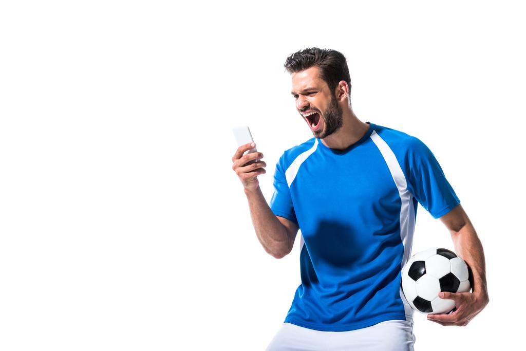 soccer player with ball yelling and using smartphone Isolated On White - Photo, Image