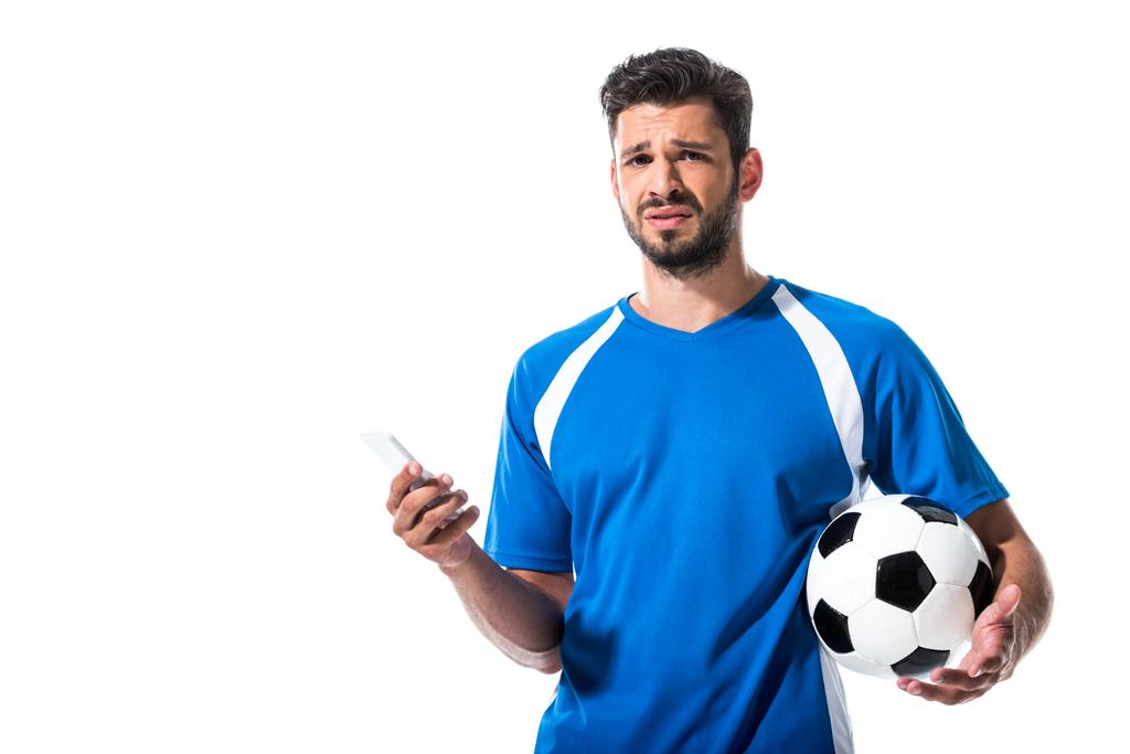confused soccer player with ball using smartphone Isolated On White - Photo, Image