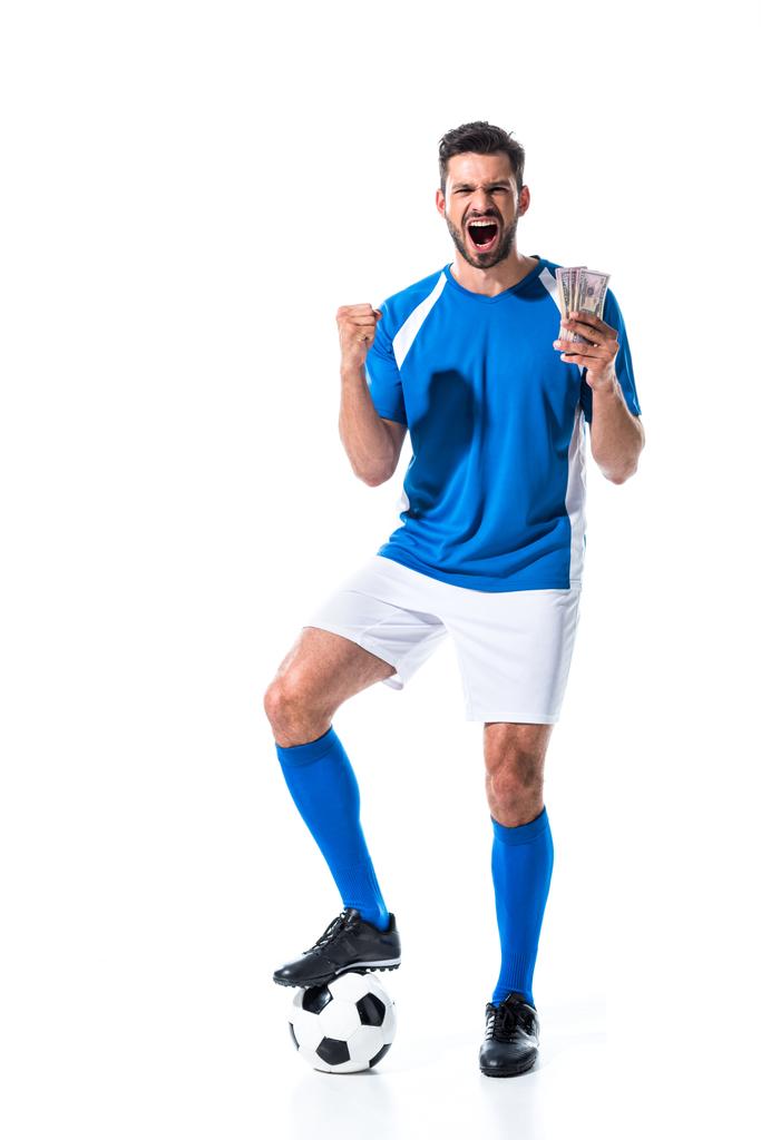 Aufgeregter Fußballer jubelt mit Dollarnoten auf weißem Grund - Foto, Bild