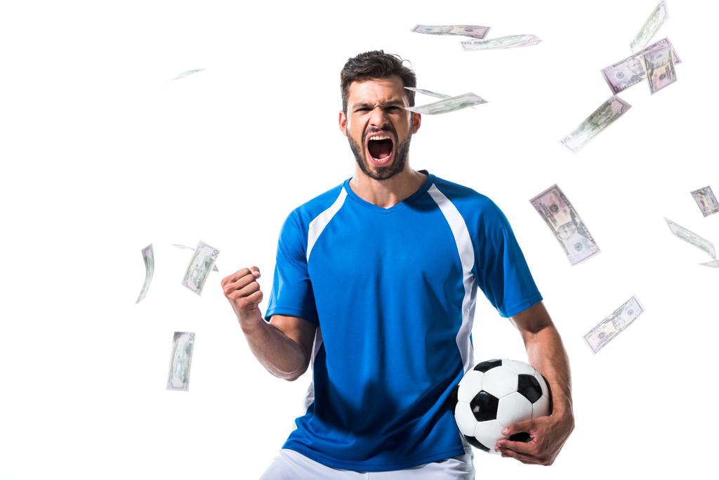 soccer player with ball cheering with clenched hand near falling money Isolated On White - Photo, Image
