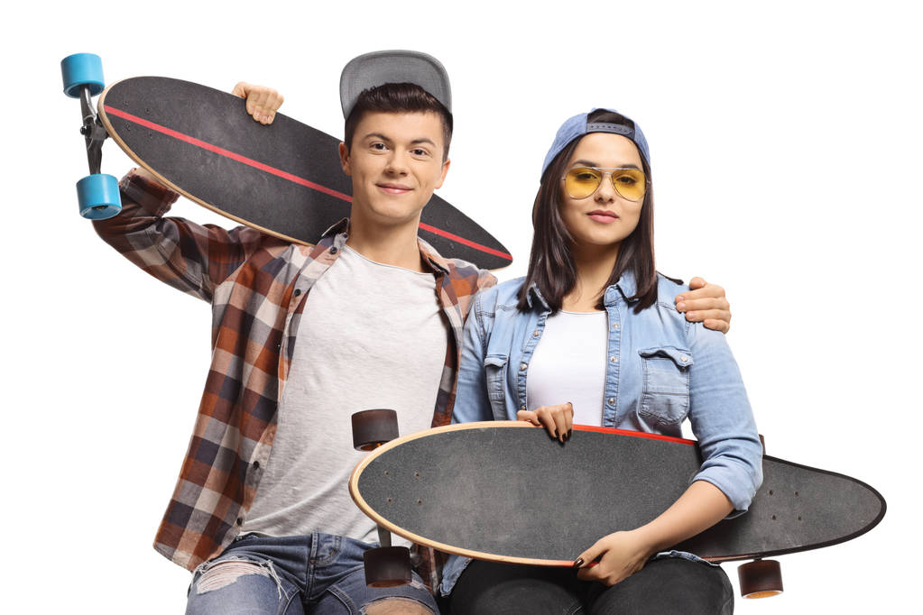 Tieners met longboards zitten  - Foto, afbeelding