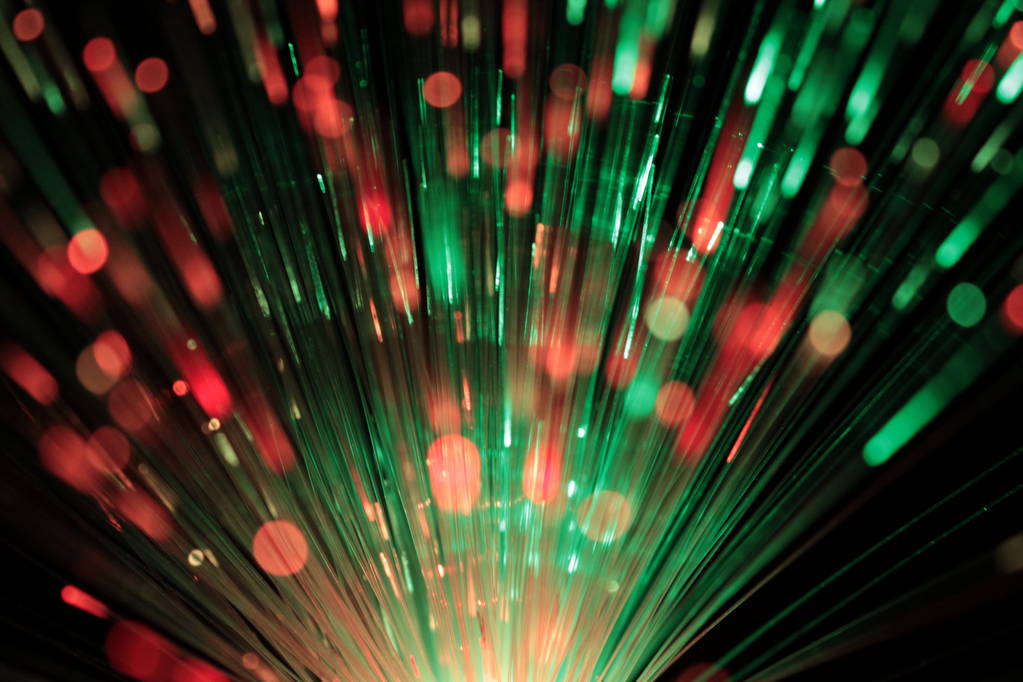 Bundle of optic fibers in red and green light - Photo, Image
