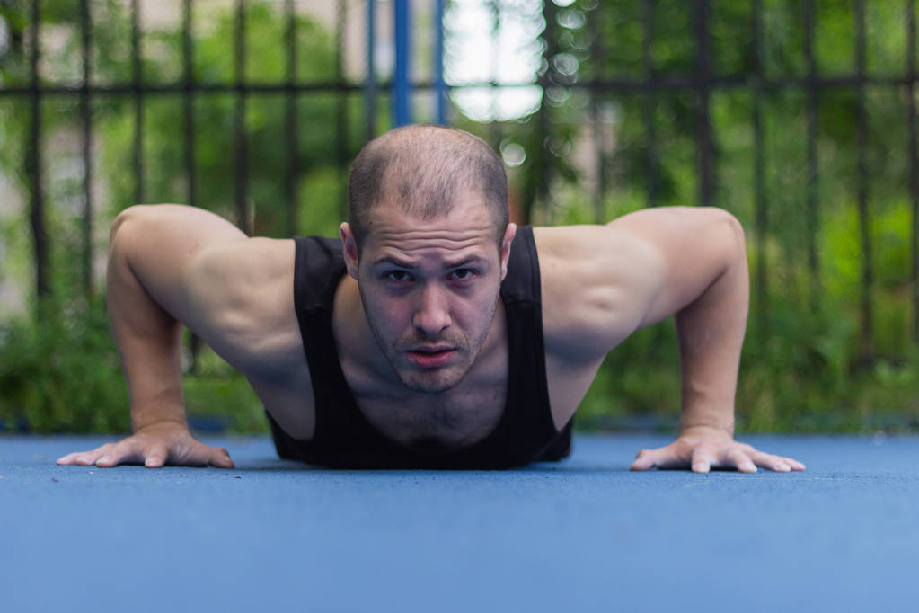 male athlete wrung out  fitness training floor push-ups workout - Photo, Image