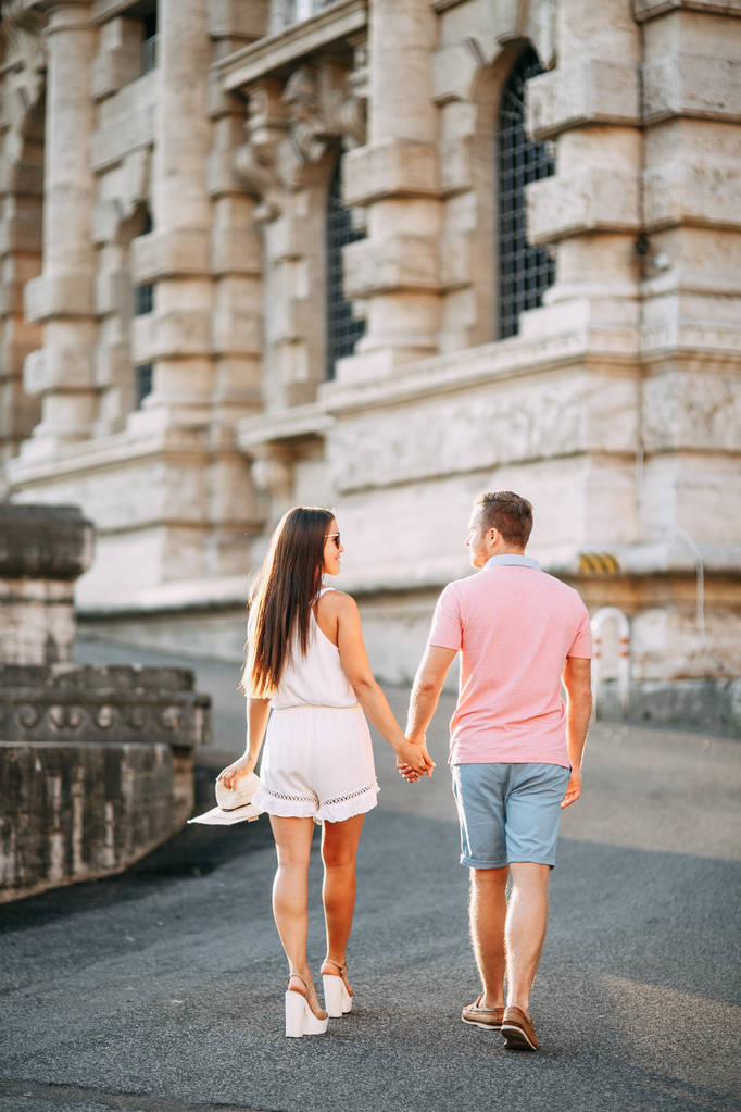 Happy couple at dawn strolling in Italy. Morning summer photo shoot in Rome.  - Photo, Image