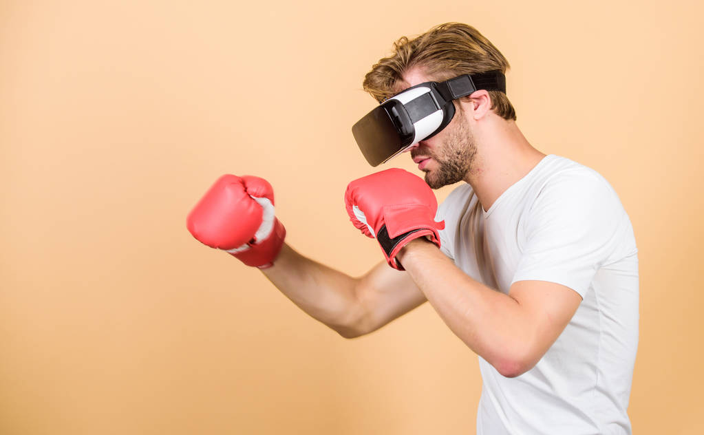 Cyber coach online training. Explore cyber space. Augmented 3D world. Cyber sportsman boxing gloves. Man play game in VR glasses. Cyber sport concept. Man boxer virtual reality headset simulation - Photo, Image