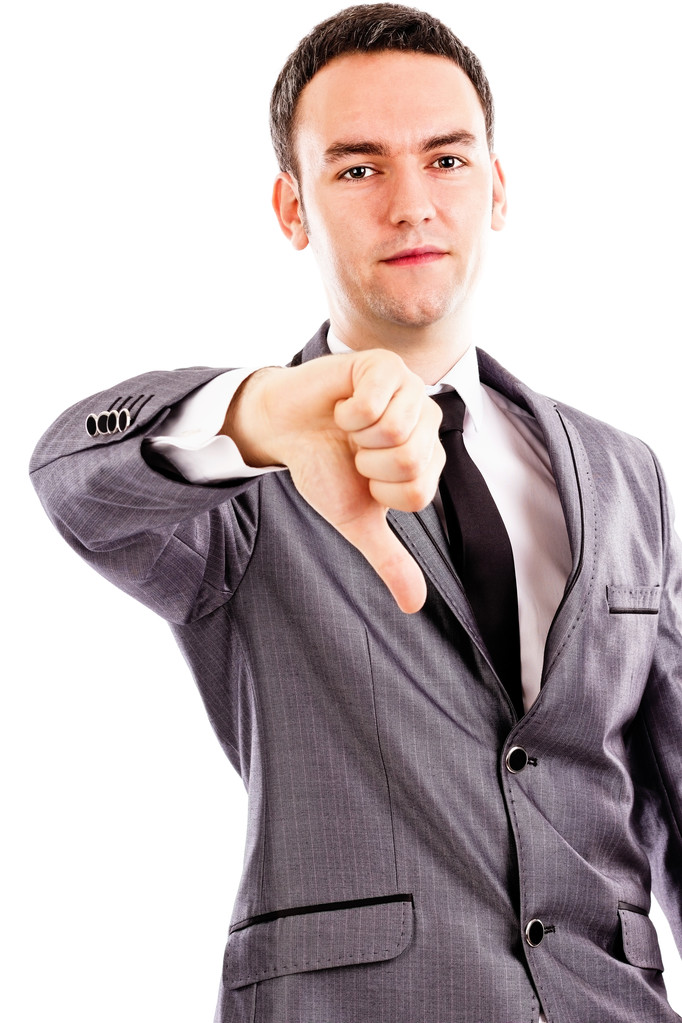 Разочарованный молодой бизнесмен показывает большой палец вниз знак
 - Фото, изображение