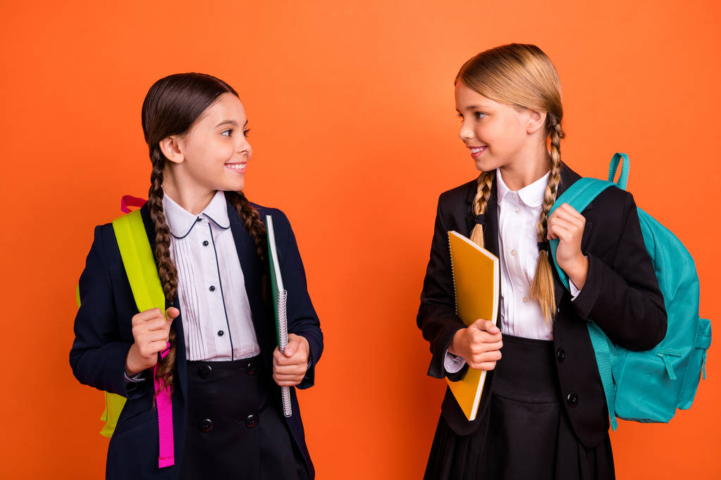 close up photo two beautiful she his little ladies funny hands arms planers ready first learn day tell holiday news wear formalwear shirt blazer school form bag isolated bright orange background - Foto, Bild