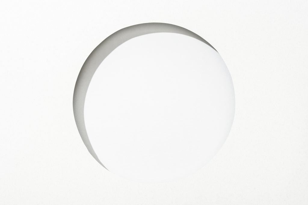 cut out round hole in white paper on white simple background - Photo, Image