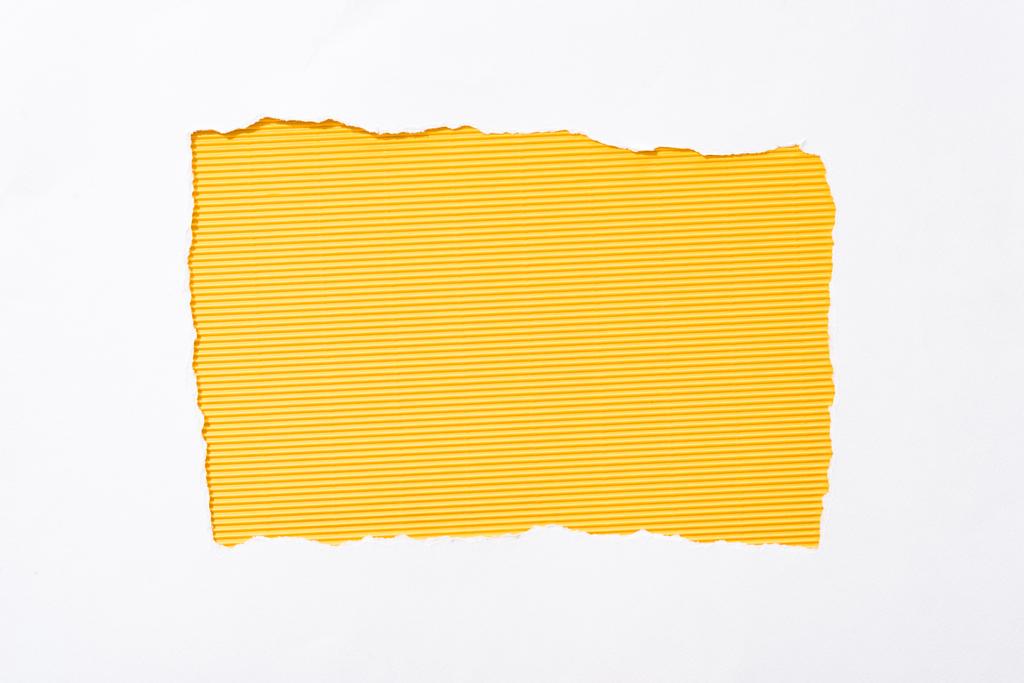 striped yellow colorful background in white torn paper hole - Photo, Image