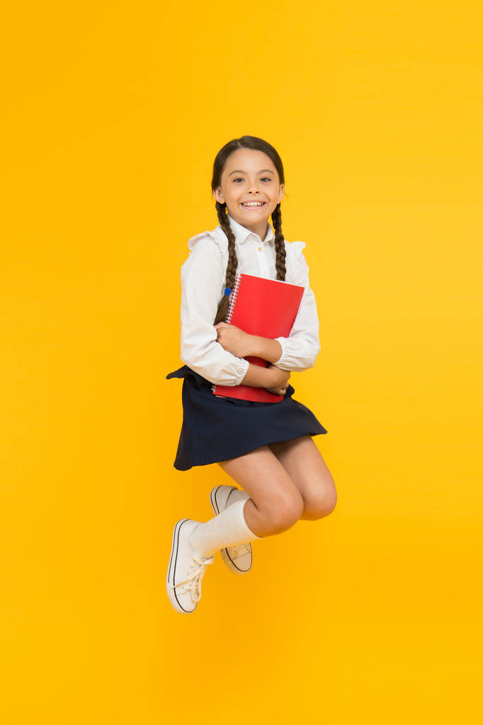 This is my book. kid learning grammar. back to school. dictionary notebook. Get information. reading story. childrens literature. cheerful girl with workbook. Education. small girl in school uniform - Photo, Image