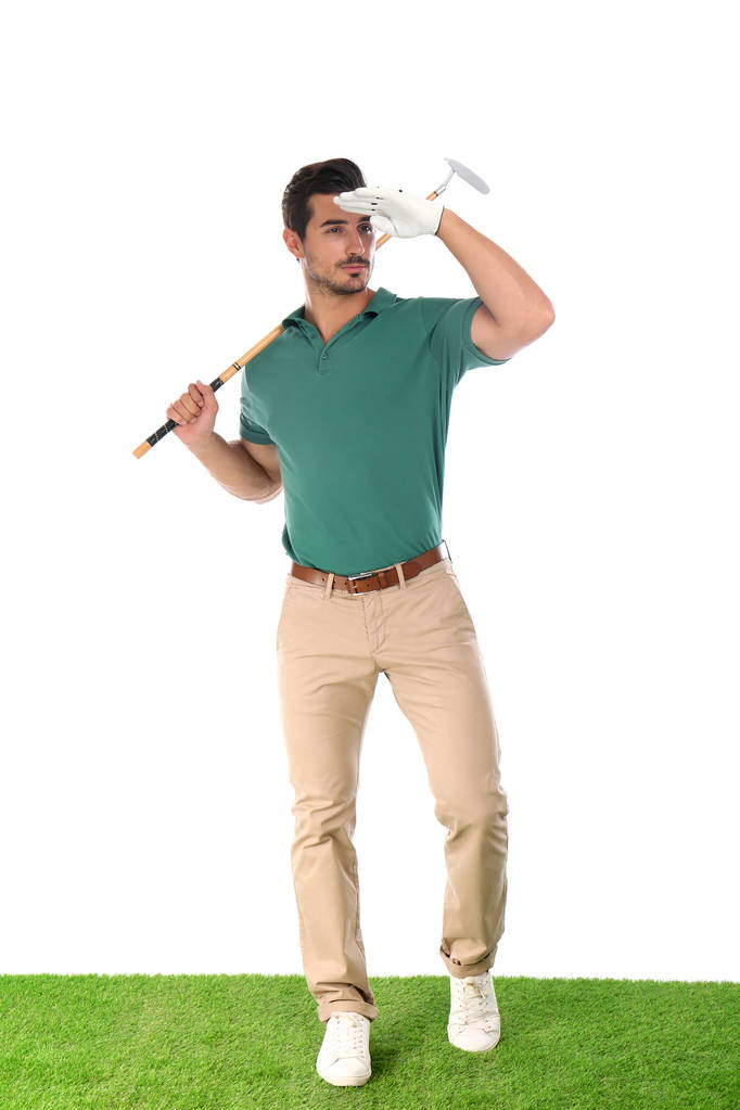 Giovane uomo in posa con golf club su sfondo bianco
 - Foto, immagini