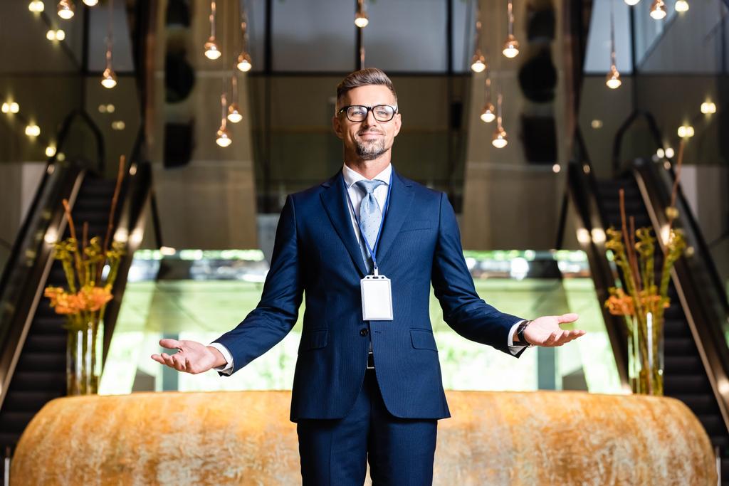 handsome businessman in suit and glasses with outstretched hands - Photo, Image