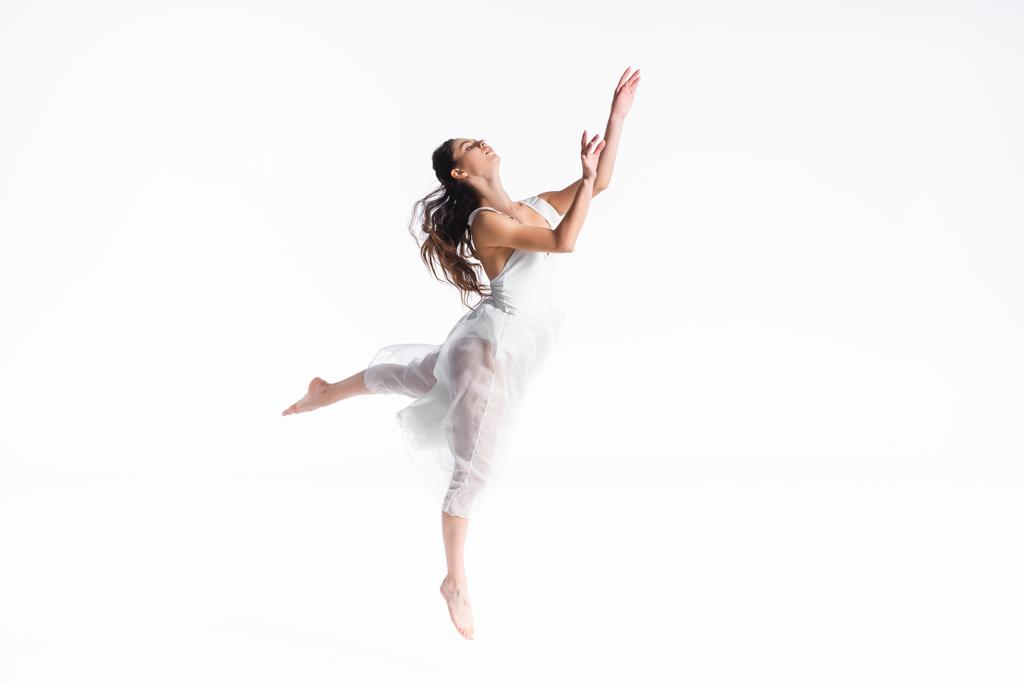 elegant, graceful ballerina in white dress dancing isolated on white - Photo, Image