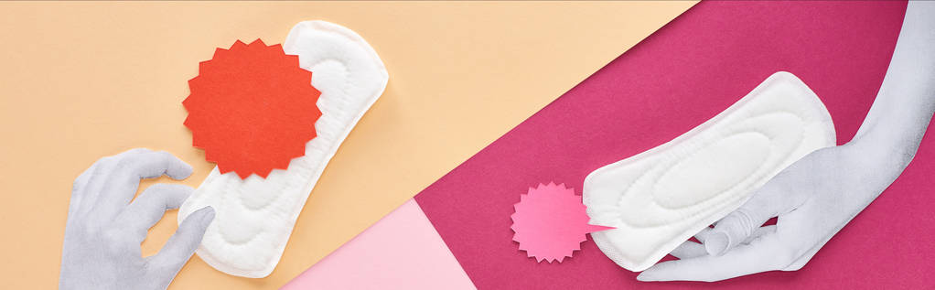 colpo panoramico di mani bianche con assorbenti igienici e carte su sfondo rosa, viola e beige
 - Foto, immagini