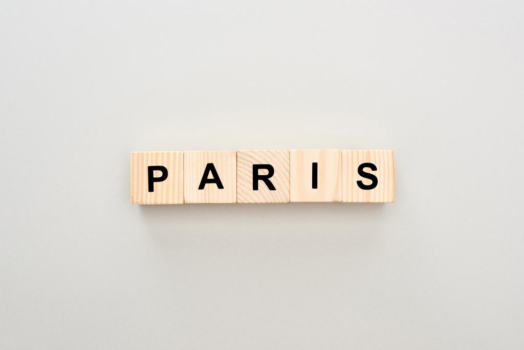 top view of wooden blocks with Paris lettering on white background - Photo, Image