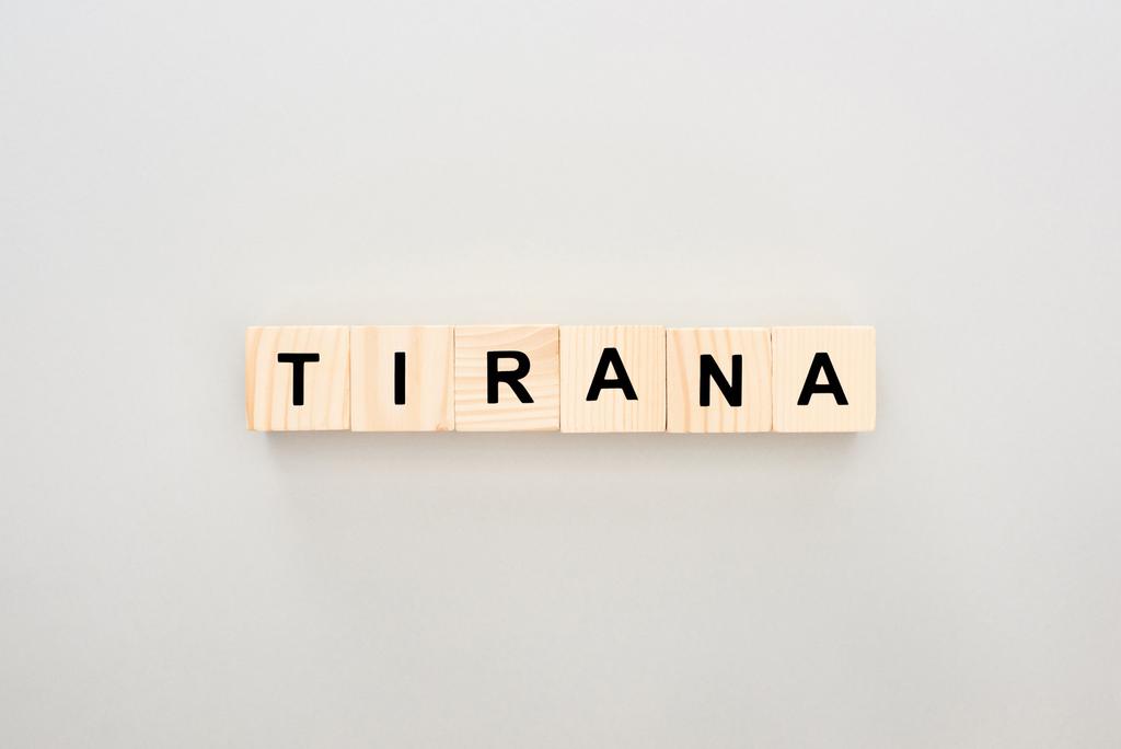 top view of wooden blocks with Tirana lettering on white background - Photo, Image