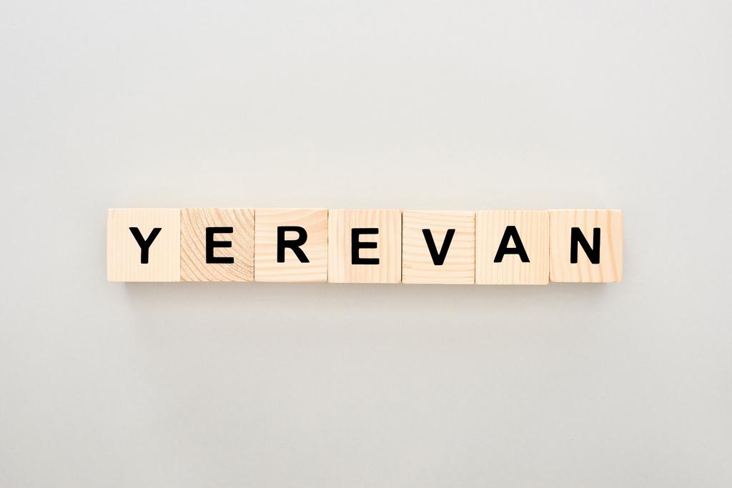 top view of wooden blocks with Yerevan lettering on white background - Photo, Image