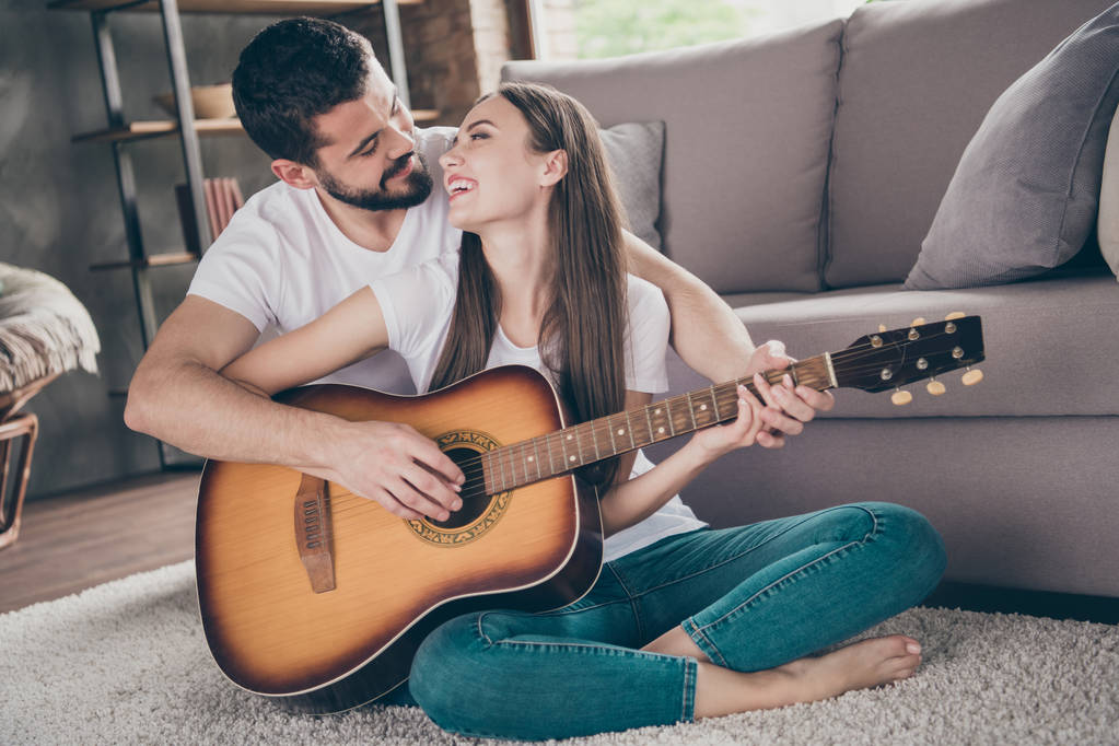Portrait of his he her she two nice-looking attractive lovely cheerful cheery positive people having fun day daydream sitting on floor performing melody at home house apartment indoors - Photo, Image