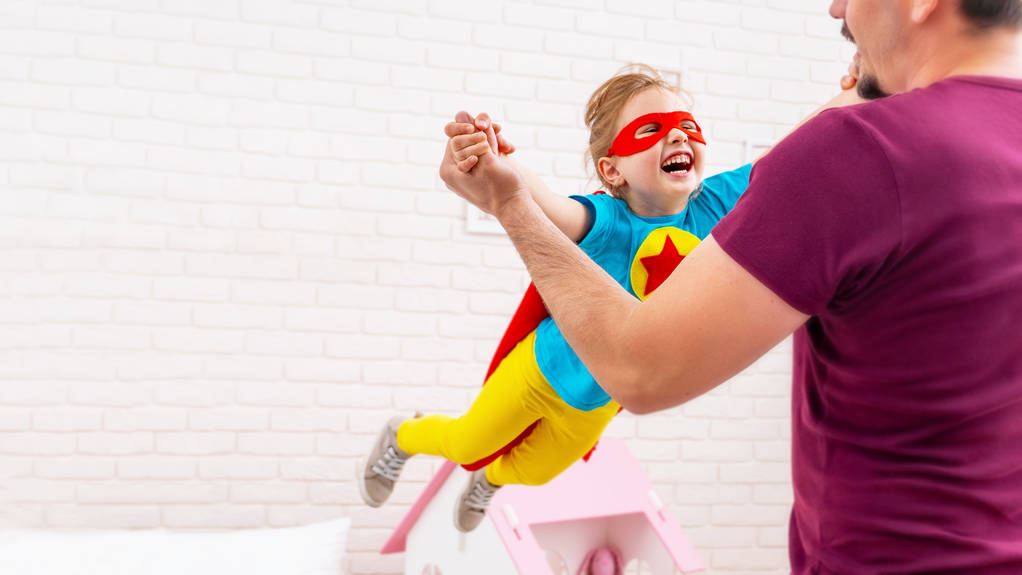 Father and daughter play superhero. - Photo, Image