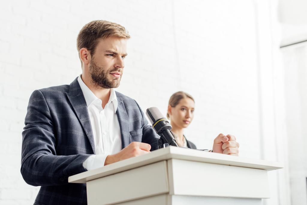 businessman in formal wear talking during conference in conference hall - Photo, Image
