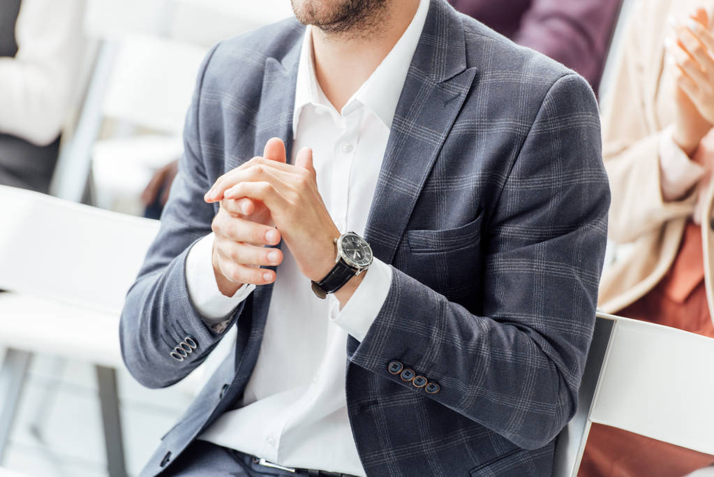 cropped view of businessman in formal wear clapping during conference  - Photo, Image