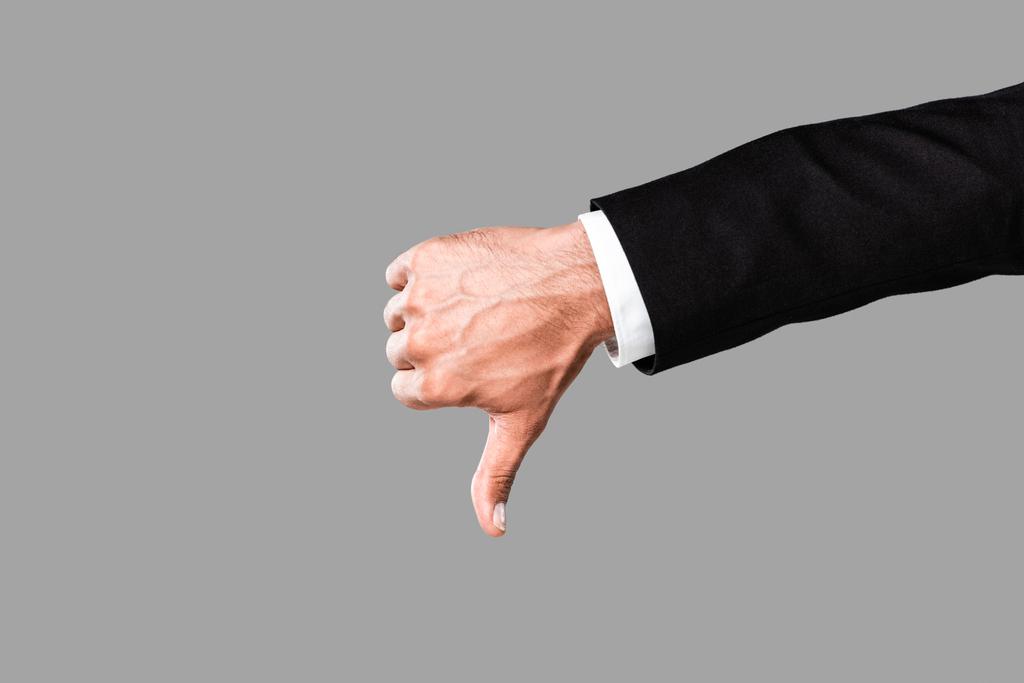 cropped view of businessman in black suit showing thumb down isolated on grey - Photo, Image