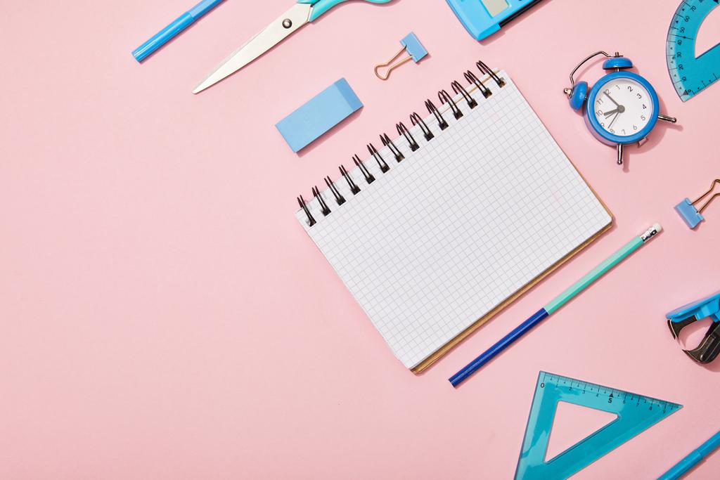 flat lay with blue school supplies and blank notebook isolated on pink - Photo, Image