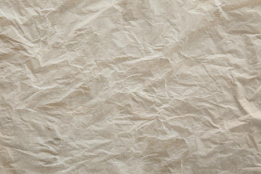 ylhäältä näkymä beige murskattu pergamentti paperin pinta kopiotilaa
 - Valokuva, kuva