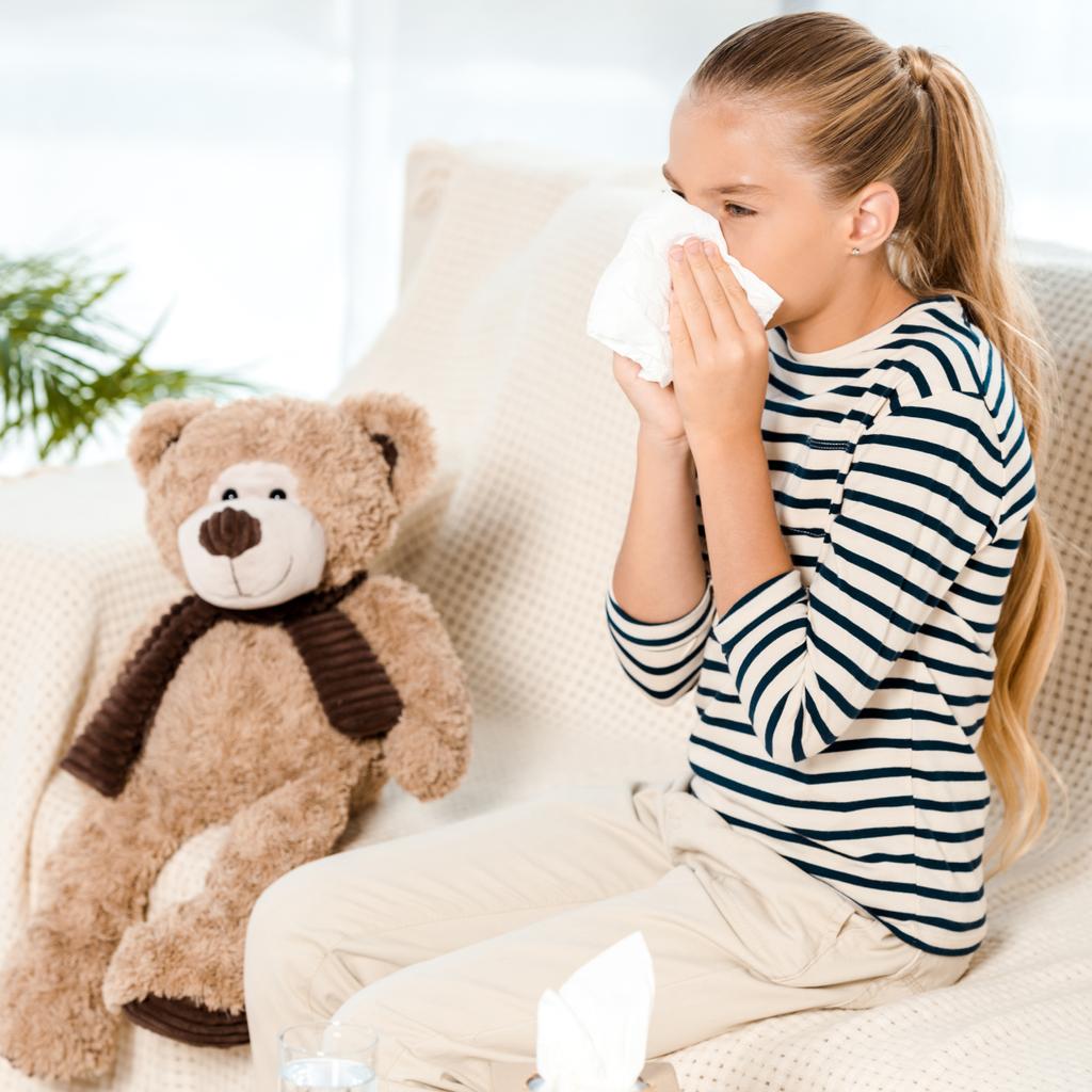diseased kid sneezing in tissue neat teddy bear  - Photo, Image